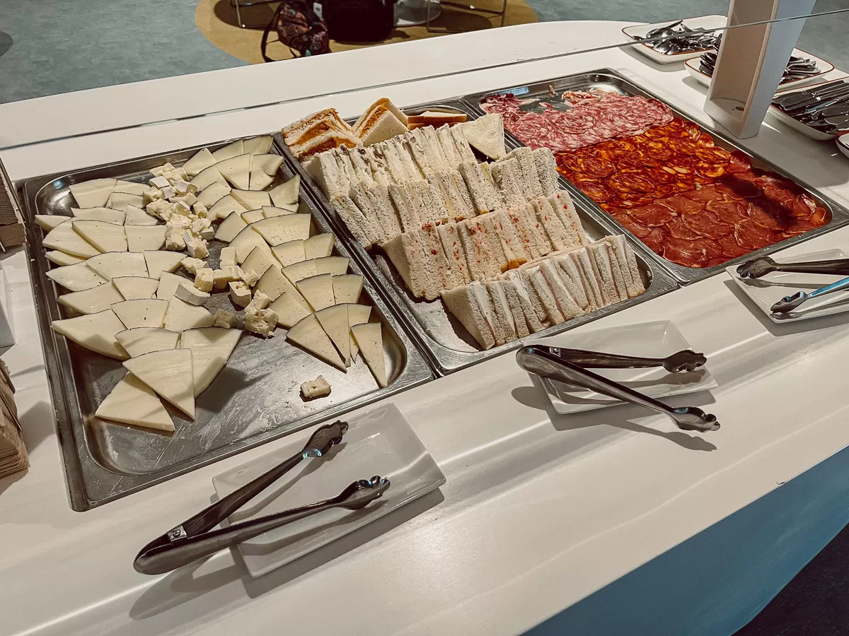 Self-serve buffet with sandwiches, ham and cheeses